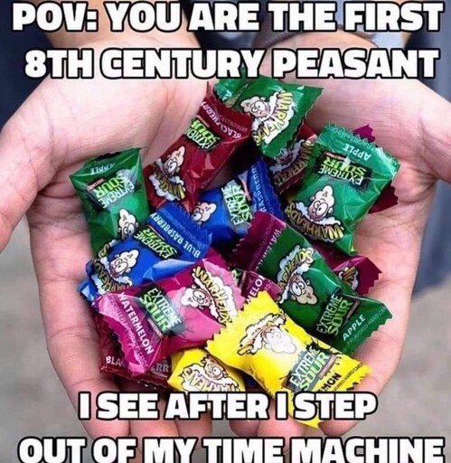 image of individually wrapped sour warhead candies in someone's hands. caption: "POV: you are the first 8th century peasant I see after I step out of my time machine"